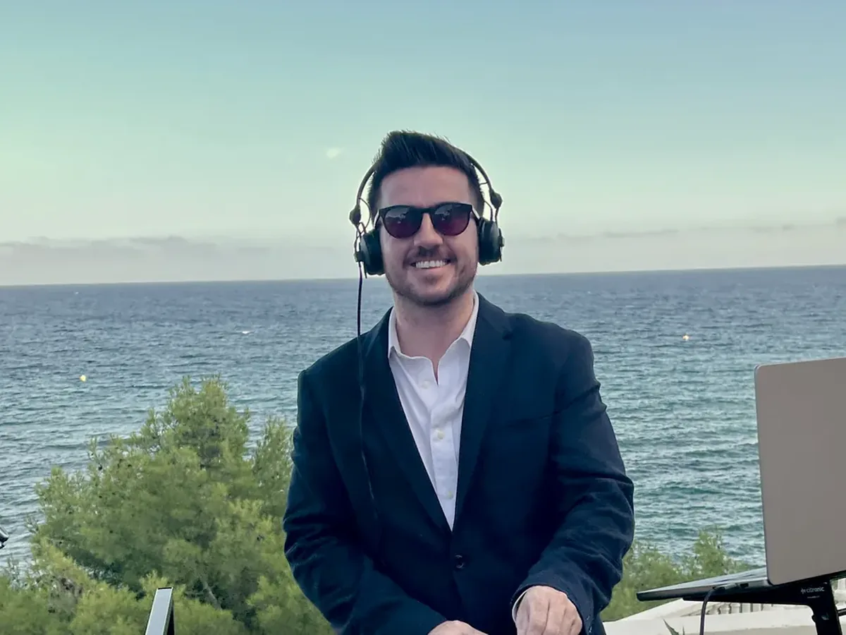 James Campbell DJing at a seaside wedding